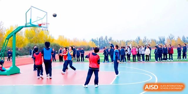 Students participate in a lively basketball match during the Sports & Cultural Events at Zibo International Academy At Hi-Tech Zone.