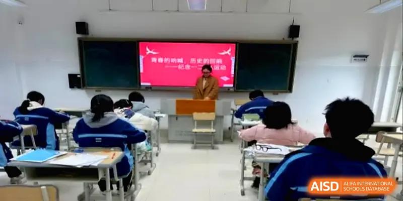 A teacher stands at the front of a classroom during an instructional session for students at The Guandu Experimental School Affiliated To Shanghai Normal University.