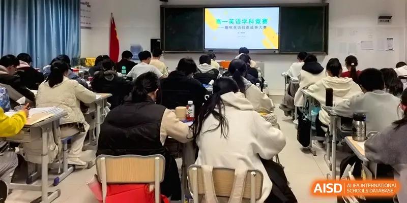 A group of students participates in a collaborative learning activity in a modern classroom at The Guandu Experimental School Affiliated To Shanghai Normal University.