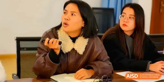 A teacher shares her insights during a collaborative staff meeting with colleagues at The Guandu Experimental School Affiliated To Shanghai Normal University.