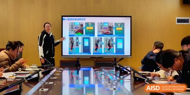 A digital monitor displays a technical presentation in an empty, modern conference room at The Guandu Experimental School Affiliated To Shanghai Normal University.
