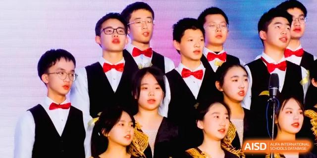 A close-up of students in formal attire singing with focus and passion during a choral performance at The Middle School Affiliated to Sichuan University.