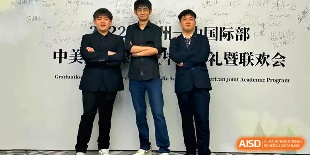 Three young men in smart casual attire pose with their arms crossed in front of a white wall at Xuzhou No.1 Middle School.