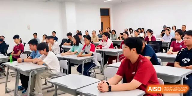 A classroom full of students sits attentively while facing the front during an instructional session at Xuzhou No.1 Middle School.