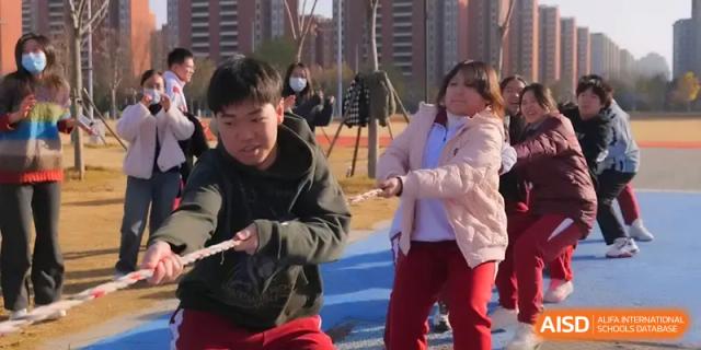 Students show their strength and teamwork during a spirited game of tug-of-war on the school grounds at Xuzhou No.1 Middle School.