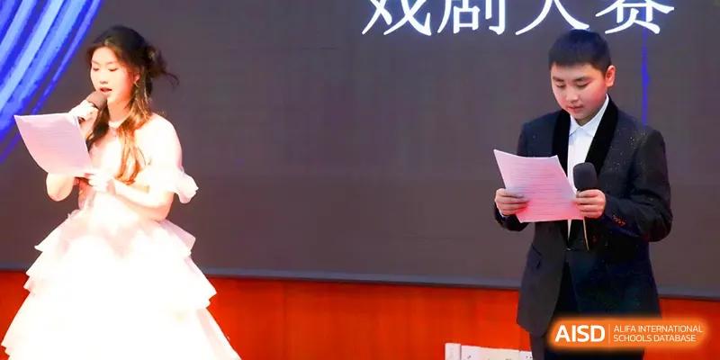 A close-up of a student participating in a formal presentation or theatrical event held in the school auditorium at Walton-Hefei School.