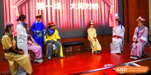 Students dressed in traditional costumes perform a dramatic stage play during a cultural festival at Walton-Hefei School.