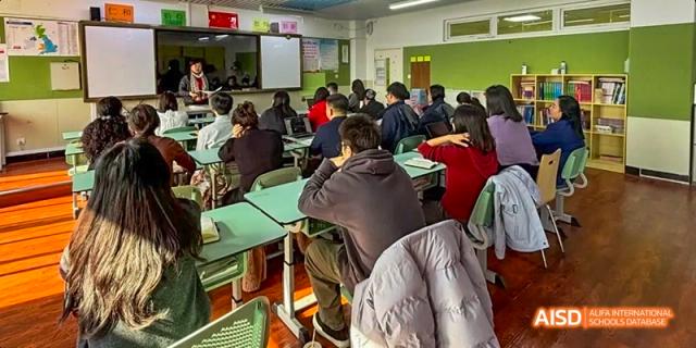 Students at Beijing Limai (International) School work in a classroom.