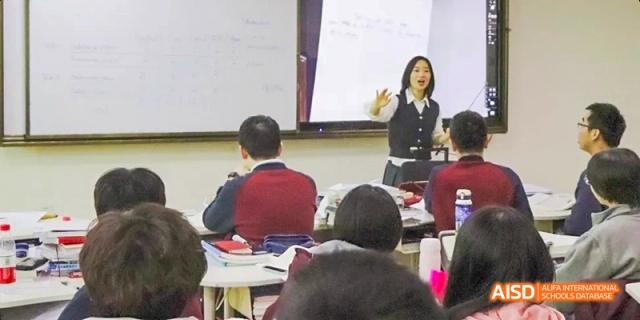 A teacher at Beijing Limai (International) School gives a lecture to a class.