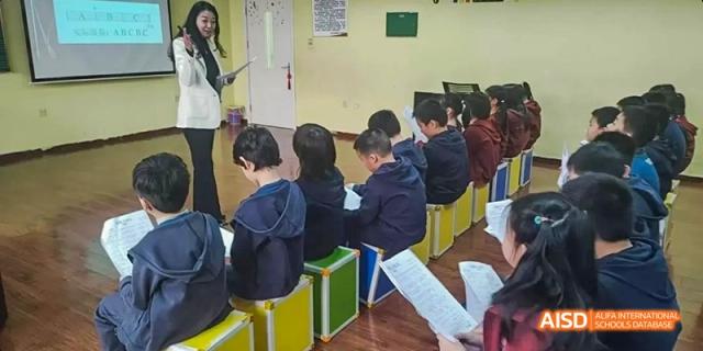 Students at Beijing Limai (International) School work in a classroom.