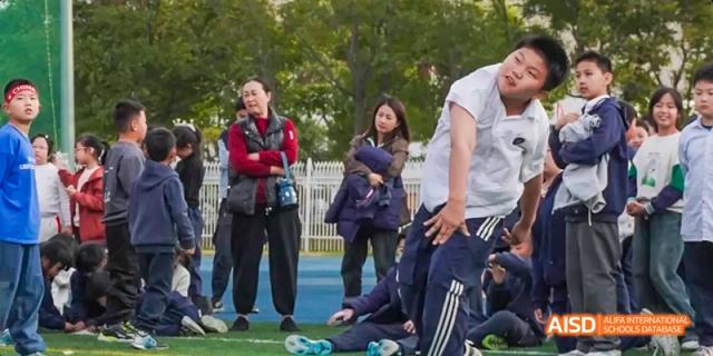 Students at Beijing Limai (International) School gather for an outdoor event.
