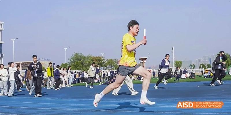 Students from Beijing Limai (International) School participate in a track and field race.