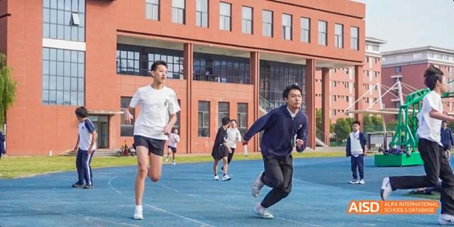 Students at Beijing Limai (International) School run outdoors.