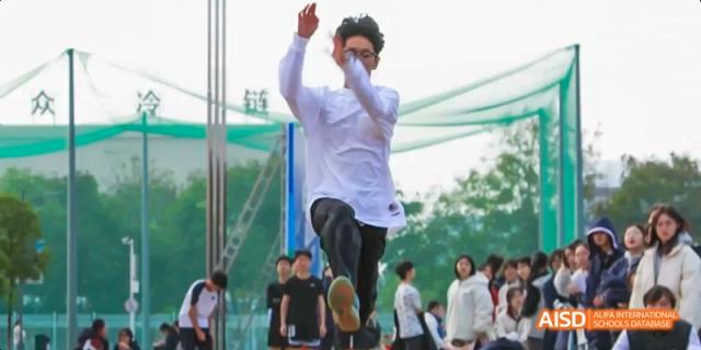 A student at Beijing Limai (International) School jumps high in the air during an activity.