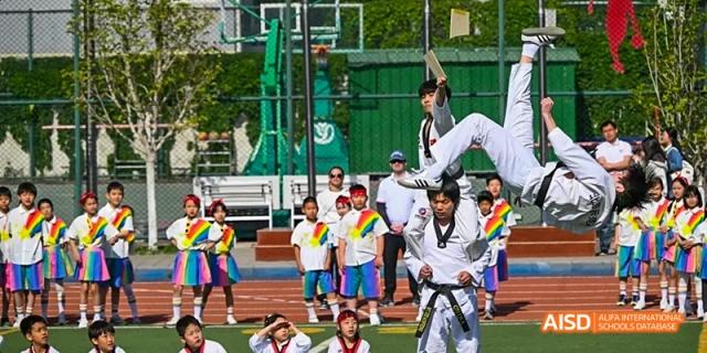Students from Beijing Limai (International) School perform a Taekwondo demonstration.