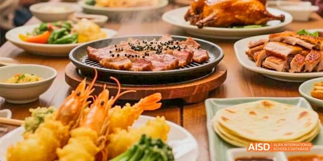 A meal with steak, shrimp, and vegetables served at Beijing Limai (International) School.