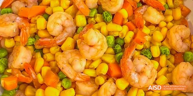 A dish with shrimp and corn at Beijing Limai (International) School.