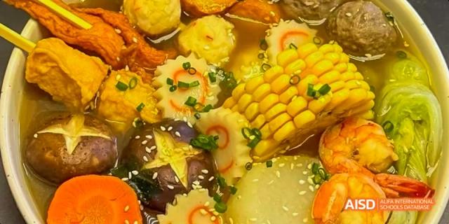 A dish with seafood and various vegetables served at Beijing Limai (International) School.