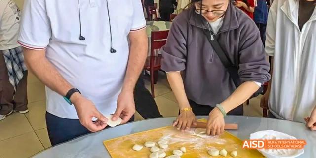 Students at Beijing Limai (International) School learn how to make dumplings.
