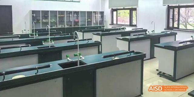 An image of an empty science laboratory with lab benches, sinks, and equipment ready for class at Maple Leaf International School Chongqing.