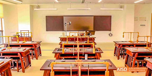 A lab setup at Fettes College Guangzhou showing science equipment like stands and clamps ready for student experiments.