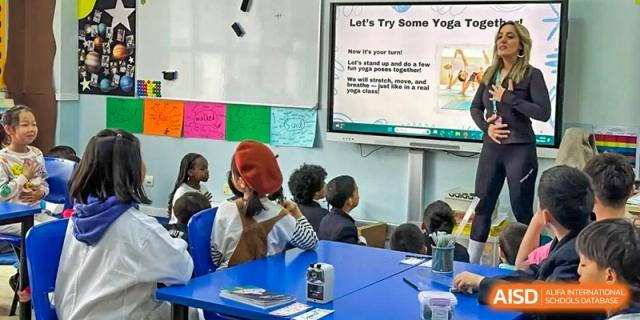 A photo showing students in a classroom with a teacher, at The British School of Beijing, Shunyi.