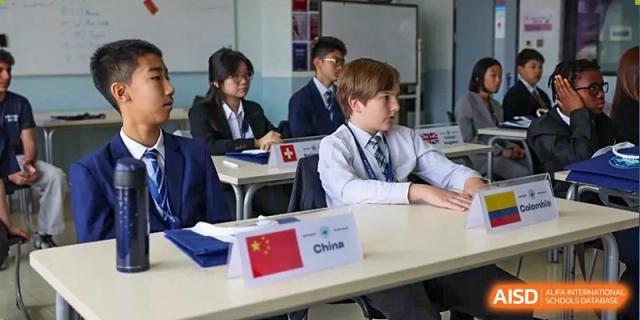 A photo showing a group of male students in a classroom, at The British School of Beijing, Shunyi.