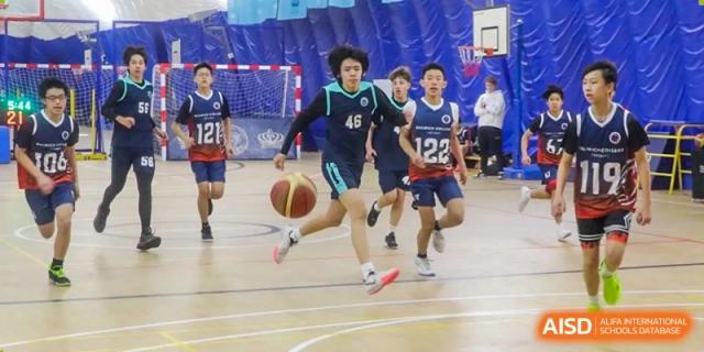 A photo showing students playing basketball, at The British School of Beijing, Shunyi.