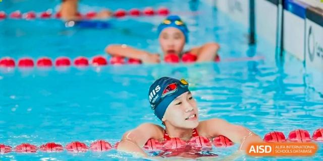 A photo showing a female student participating in a swimming competition, at The British School of Beijing, Shunyi.