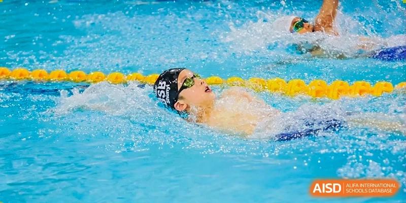 A photo showing a male student participating in a swimming competition, at The British School of Beijing, Shunyi.