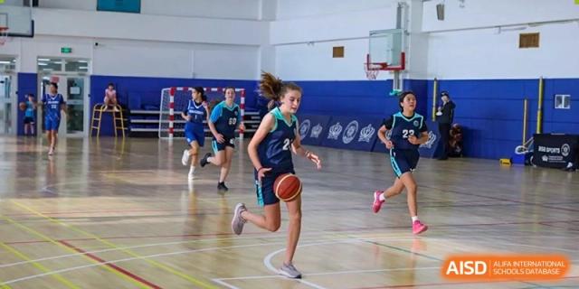 A photo showing students playing basketball, at The British School of Beijing, Shunyi.