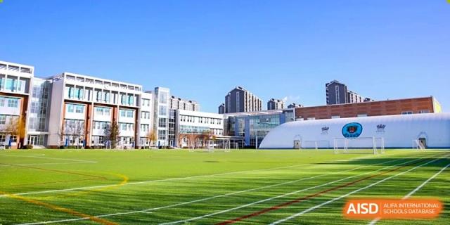 A photo showing a football stadium, at The British School of Beijing, Shunyi.