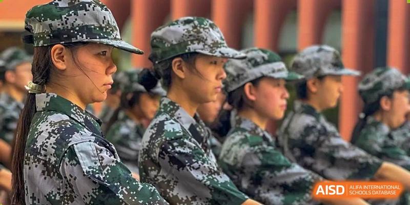 Zhengzhou No.9 High School International Department student in a camouflage uniform, participating in a group activity or military training.