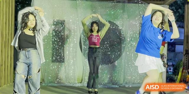A Zhengzhou No.9 High School International Department female student posing in a dance or performance setting.