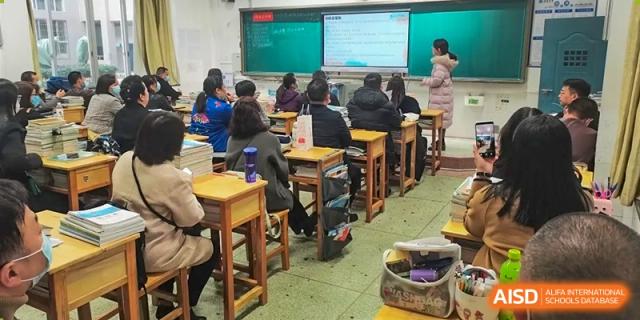 A classroom scene at Zhounan High School with students seated at desks during a lesson.