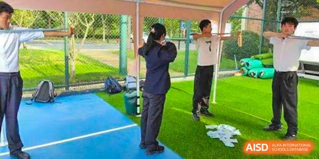 Students are participating in an outdoor activity or exercise. Hangzhou Dipont School of Arts and Science.