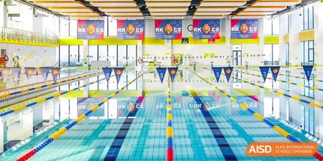 An indoor swimming pool with multiple lanes. Hangzhou Dipont School of Arts and Science.