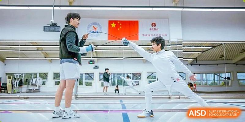 Ningbo Huamao International School student fencing in a gymnasium during a competition.
