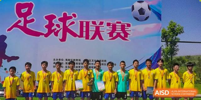 A promotional poster or banner for a football (soccer) league, showing a group of students wearing medals, at Yichang Tianwen International School.
