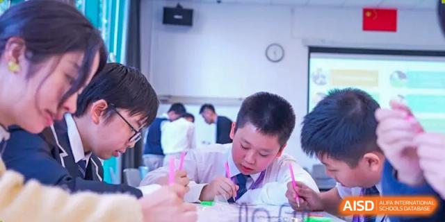 A young student from Shenzhen Oasis International School works on an art project in a classroom.