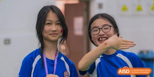Two students from Shenzhen Oasis International School smiling and posing for a photo.