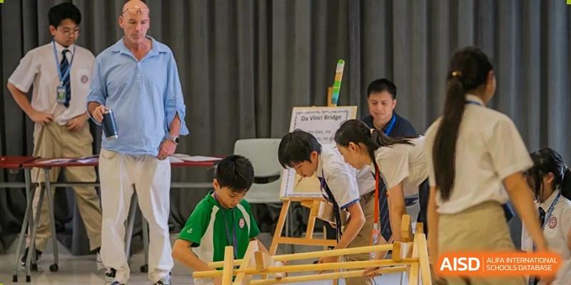 Students from Shenzhen Oasis International School collaborating on a project or an experiment in a classroom.
