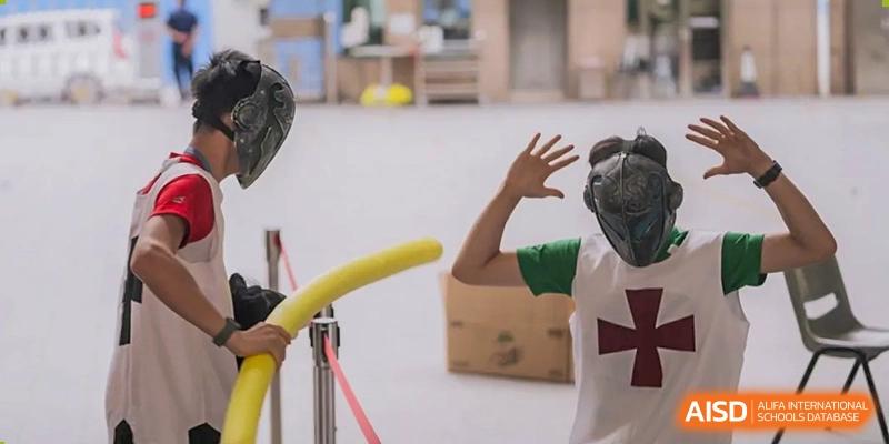 An arm from Shenzhen Oasis International School attempts to grab an object during a fun activity.