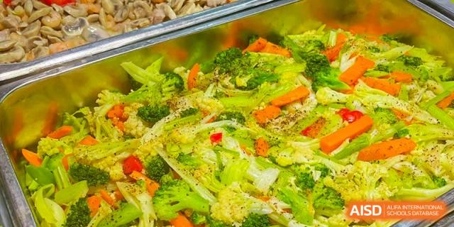 A large tray of mixed vegetables from the cafeteria at Shenzhen Oasis International School.