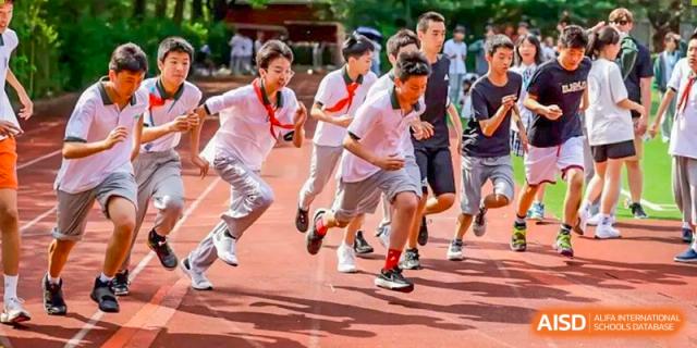 Students from World Leading Schools Association participating in a running event or race outdoors.