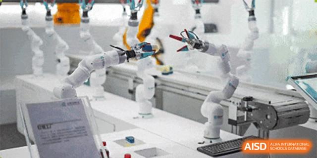 Small robotic arms being tested or demonstrated in a science or robotics lab at Shenzhen Yunding School.