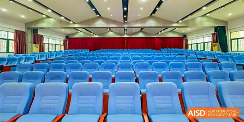 Empty blue seating rows in the auditorium or lecture hall of Shenzhen Yunding School.