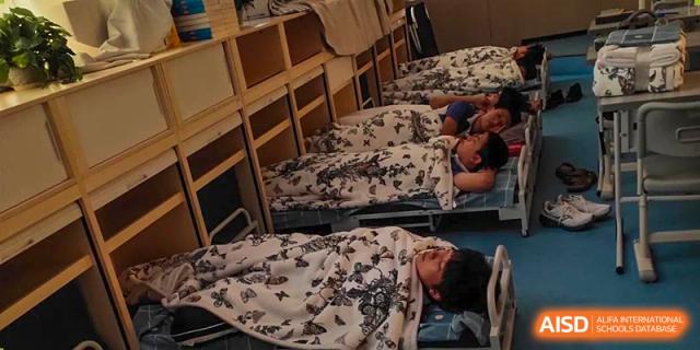 Students sleeping in bunk beds at a dormitory in Shenzhen Yunding School.