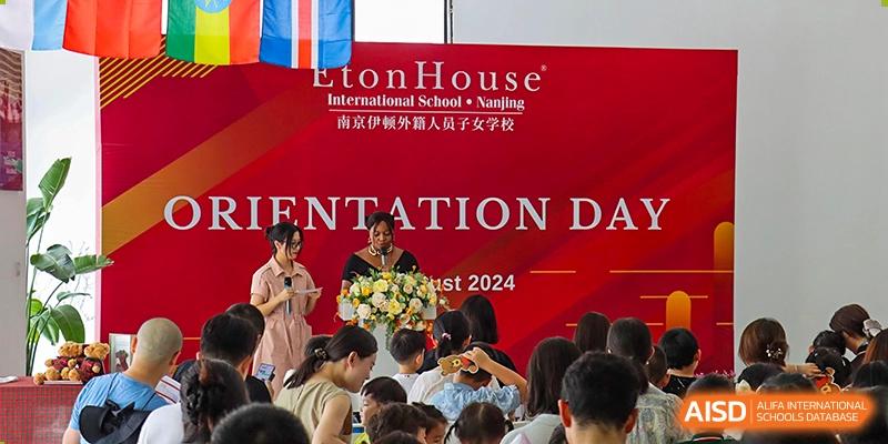 Students and teachers from EtonHouse International School Nanjing on a stage during an orientation day event.