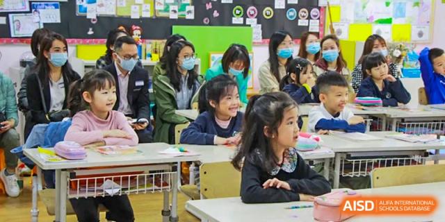 Students from EtonHouse International School Nanjing wearing face masks in a classroom.